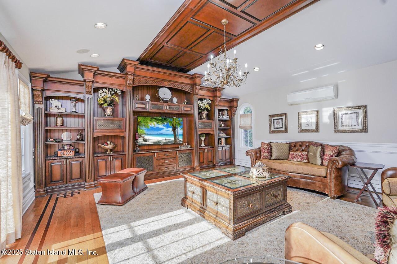62 Ruxton Avenue Staten Island, NY 10312 - Photo 16 of 71 a living room with furniture and a flat screen tv