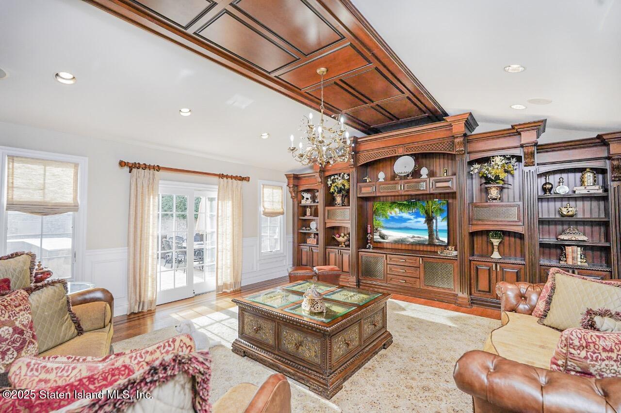 62 Ruxton Avenue Staten Island, NY 10312 - Photo 17 of 71 a living room with furniture and a flat screen tv