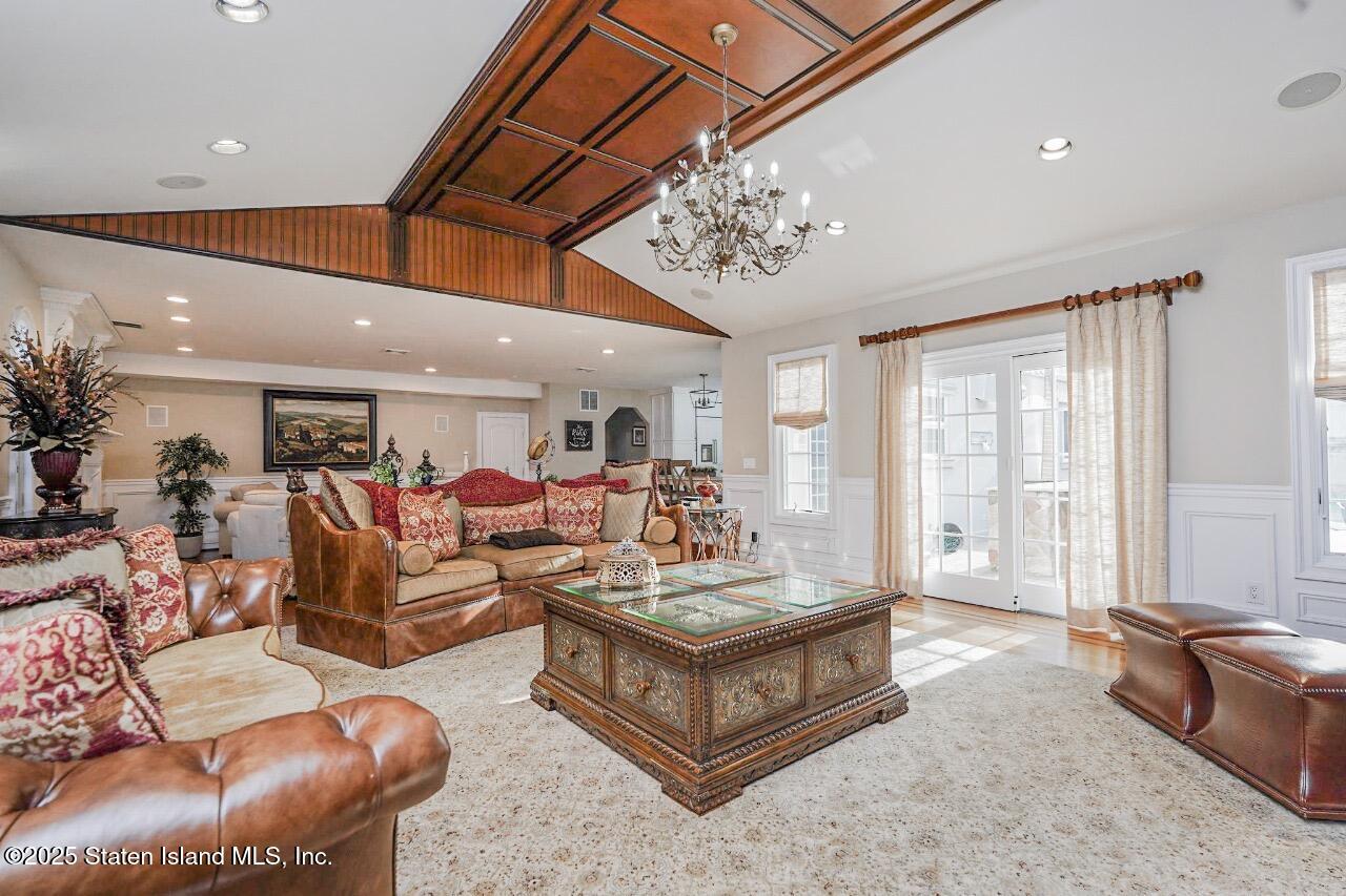 62 Ruxton Avenue Staten Island, NY 10312 - Photo 18 of 71 a living room with furniture and a large window