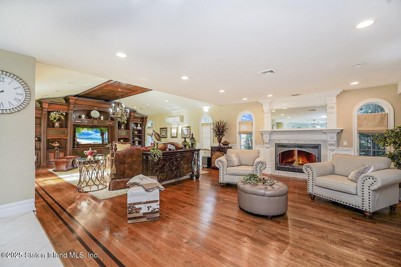 62 Ruxton Avenue Staten Island, NY 10312 - Photo 19 of 71 a living room with furniture and a fireplace