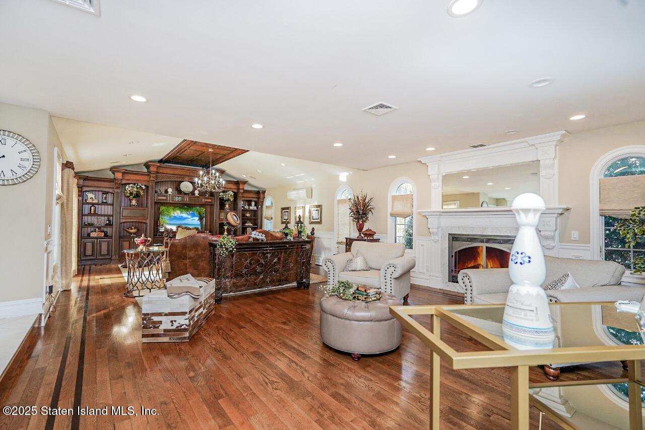 62 Ruxton Avenue Staten Island, NY 10312 - Photo 20 of 71 a living room with furniture a fireplace and a fireplace