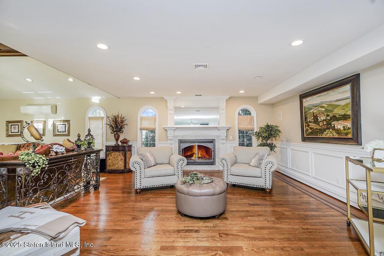 62 Ruxton Avenue Staten Island, NY 10312 - Photo 21 of 71 a living room with furniture and a fireplace