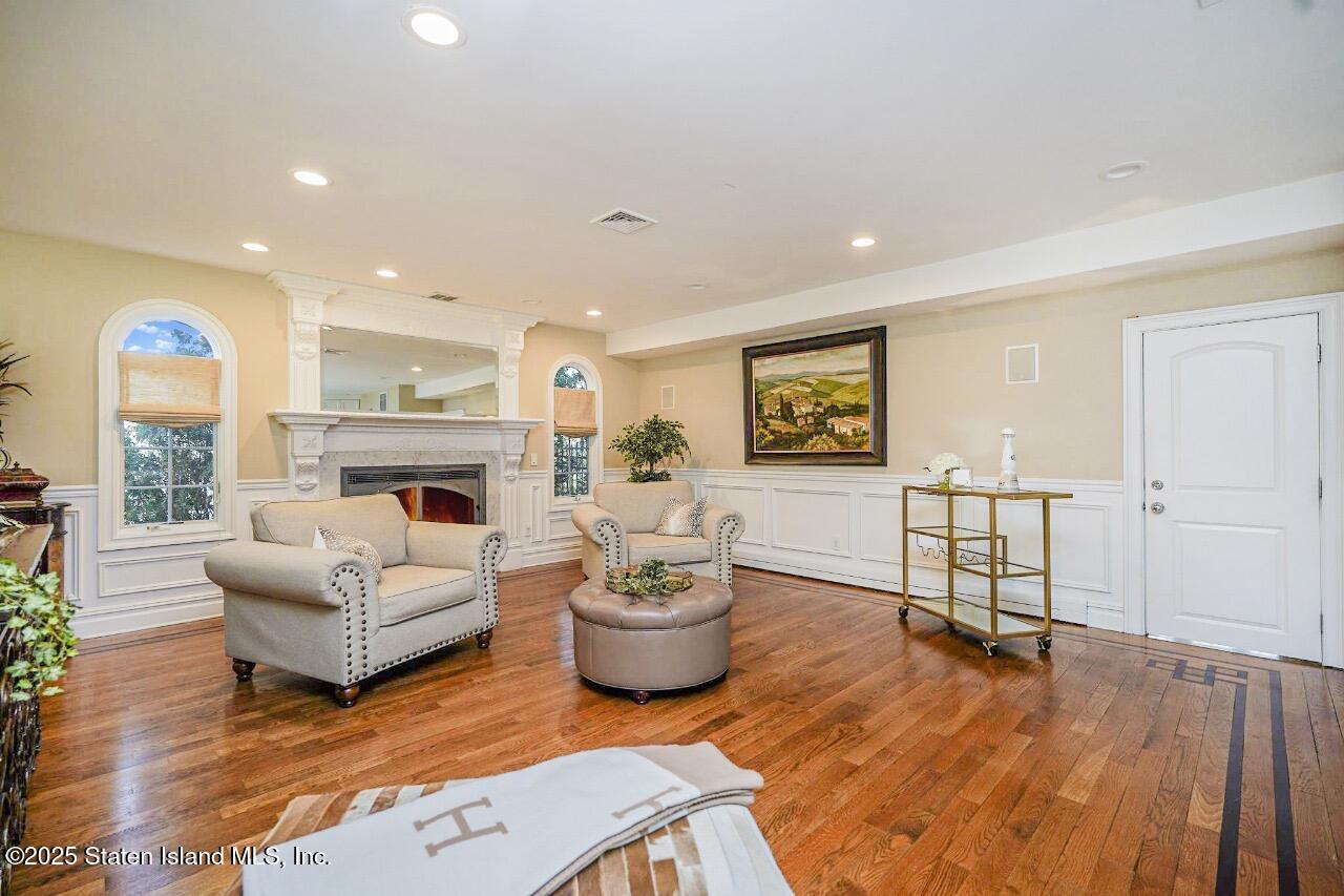 62 Ruxton Avenue Staten Island, NY 10312 - Photo 22 of 71 a living room with furniture and a fireplace