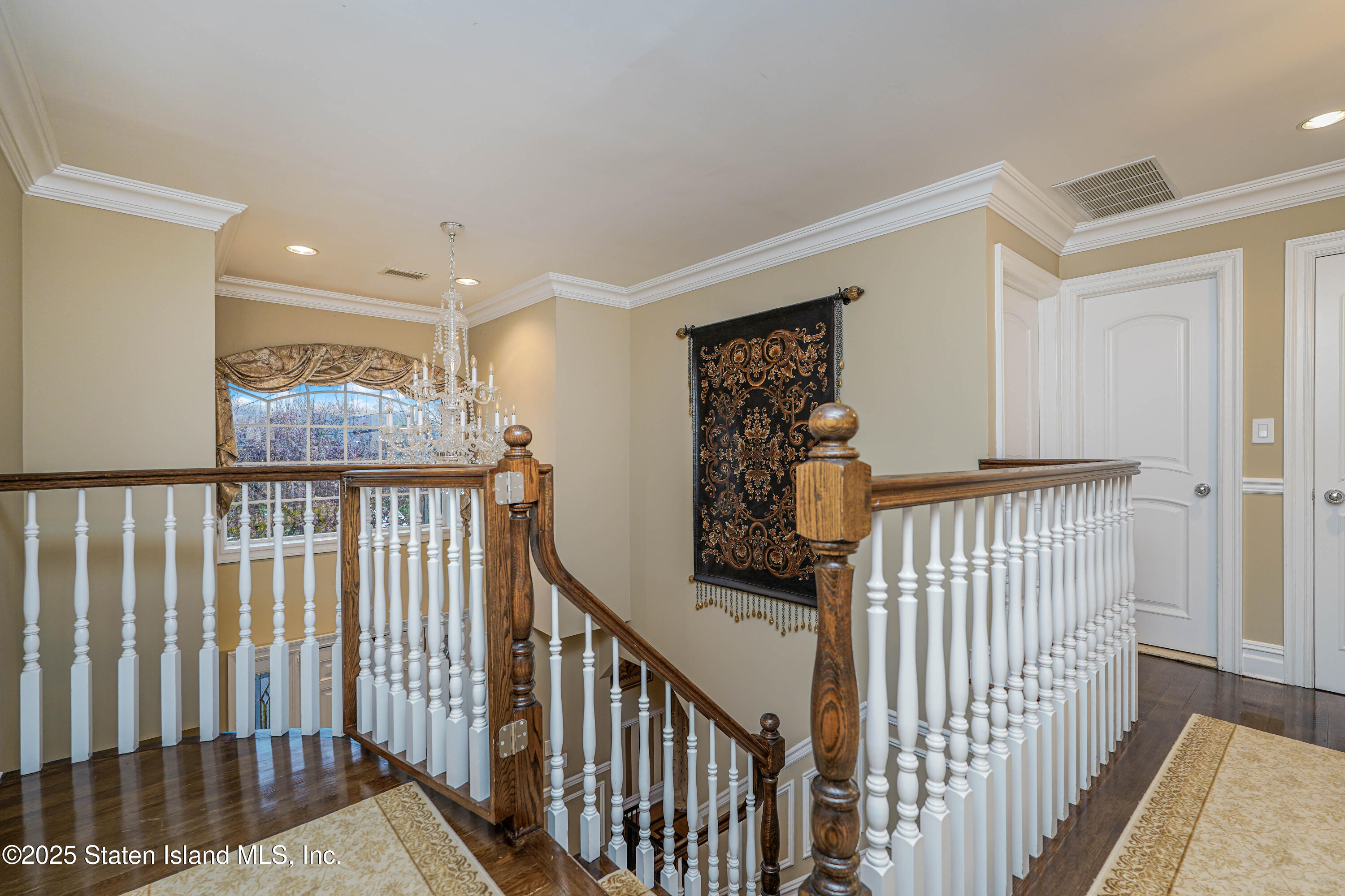 62 Ruxton Avenue Staten Island, NY 10312 - Photo 29 of 71 a view of a hallway with wooden floor and stairs