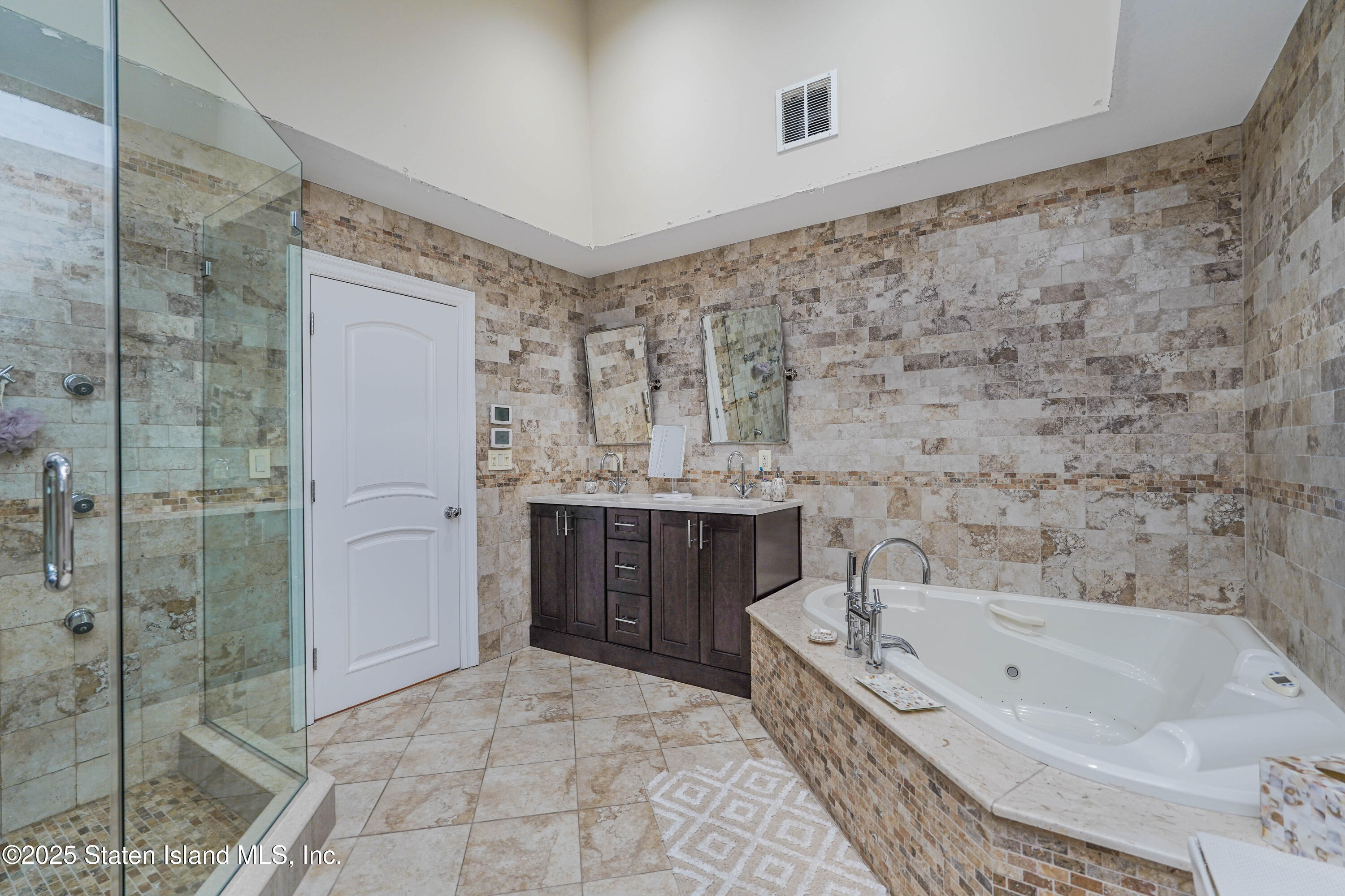 62 Ruxton Avenue Staten Island, NY 10312 - Photo 44 of 71 a bathroom with a bathtub and a shower