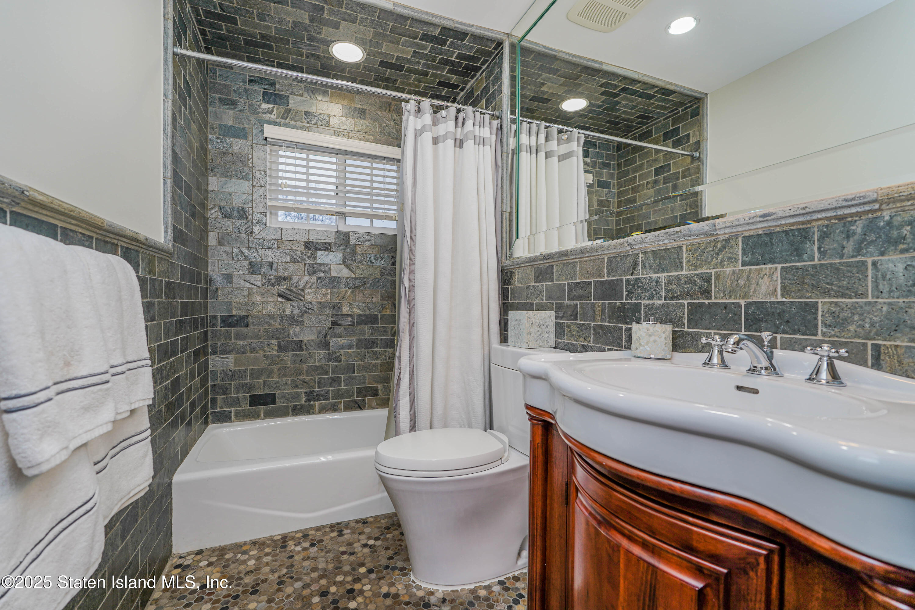 62 Ruxton Avenue Staten Island, NY 10312 - Photo 45 of 71 a bathroom with a sink toilet and shower