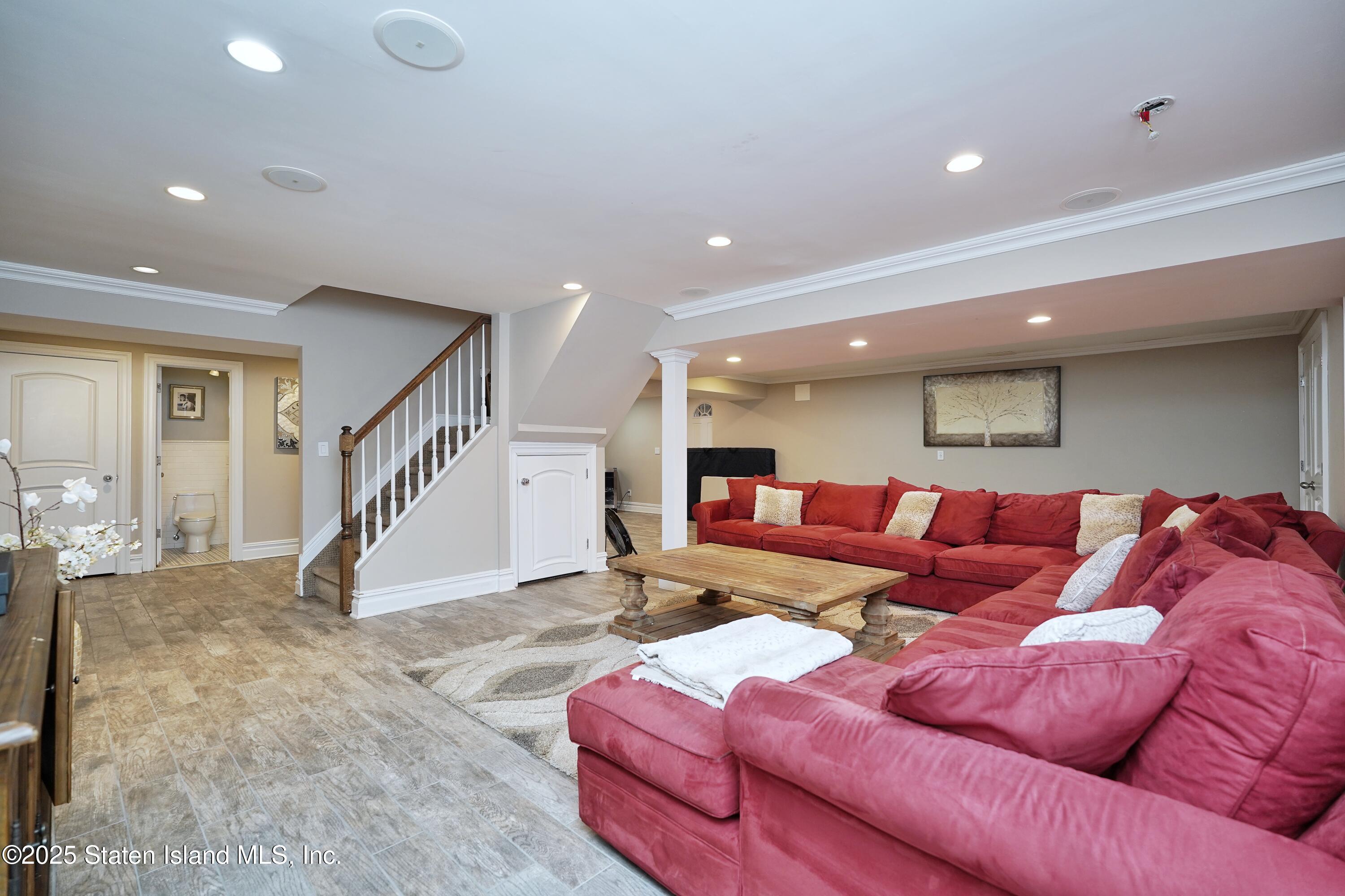 62 Ruxton Avenue Staten Island, NY 10312 - Photo 53 of 71 a living room with furniture and stairs