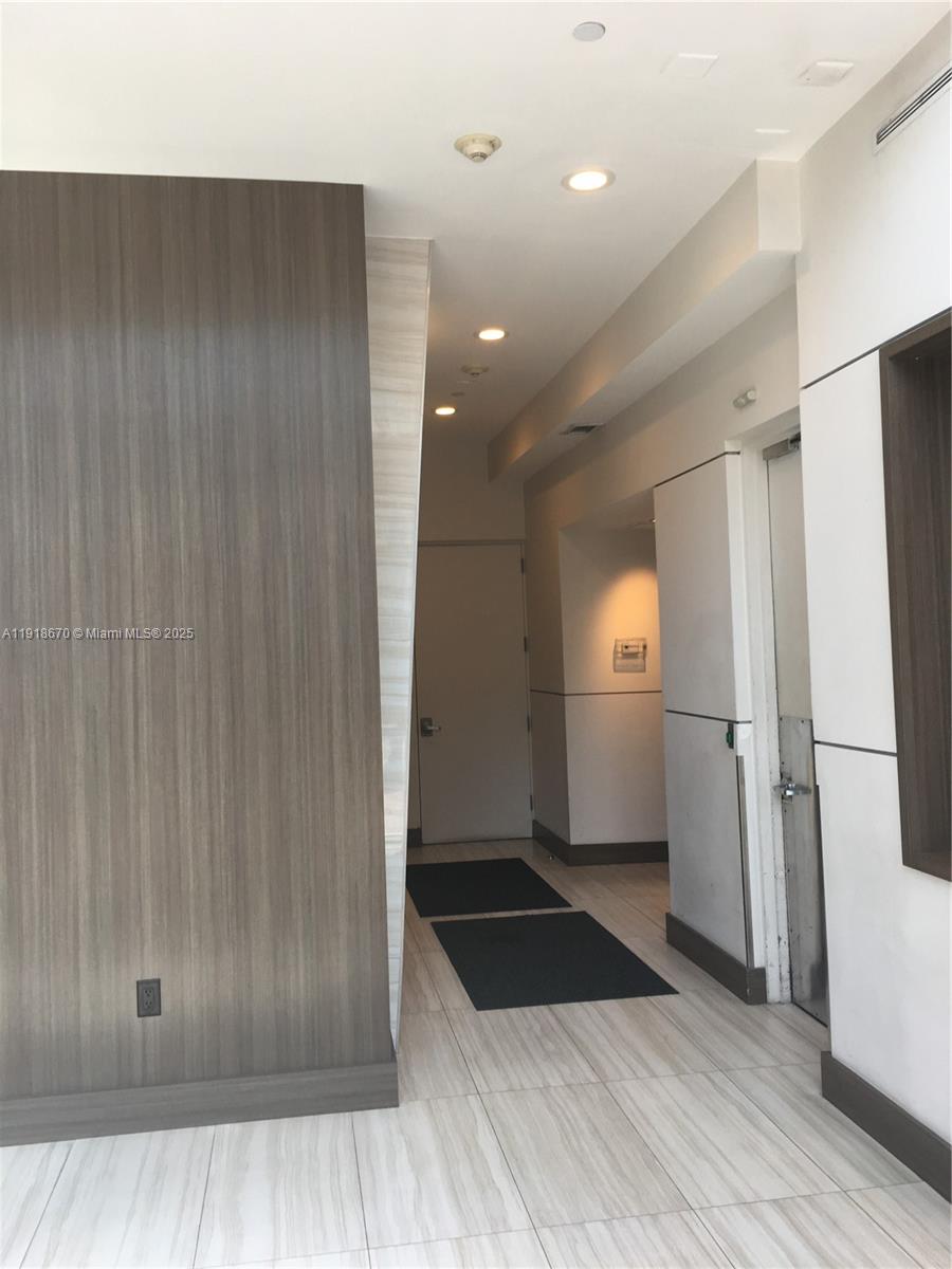 200 Ocean Drive, Unit 3C Miami Beach, FL 33139 - Photo 4 of 12 a bathroom with a mirror and a shower