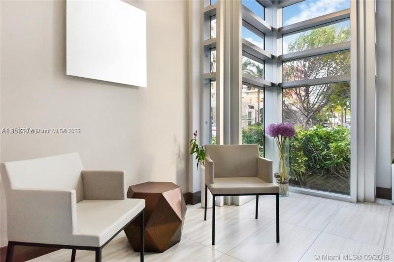 200 Ocean Drive, Unit 3C Miami Beach, FL 33139 - Photo 8 of 12 a view of a room that has a bench and a window