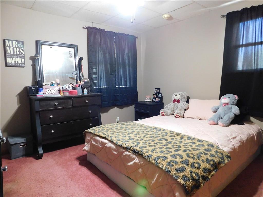 543 North Main Street Masontown, PA 15461 - Photo 12 of 32 a bedroom with a bed and window