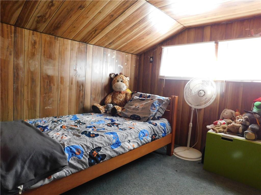 543 North Main Street Masontown, PA 15461 - Photo 23 of 32 a bed sitting in a bedroom next to a window