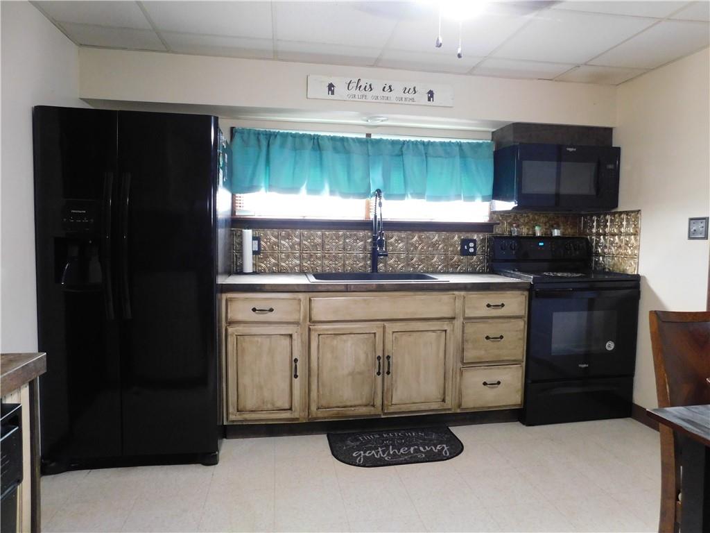 543 North Main Street Masontown, PA 15461 - Photo 7 of 32 a kitchen with a cabinets and a stove