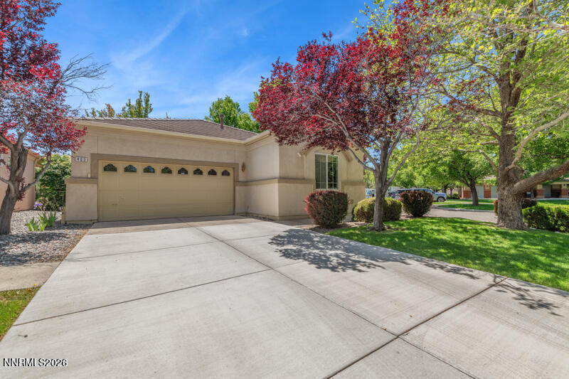 403 Sierra Leaf Circle Reno, NV 89511 - Photo 1 of 25 a front view of a house with a yard