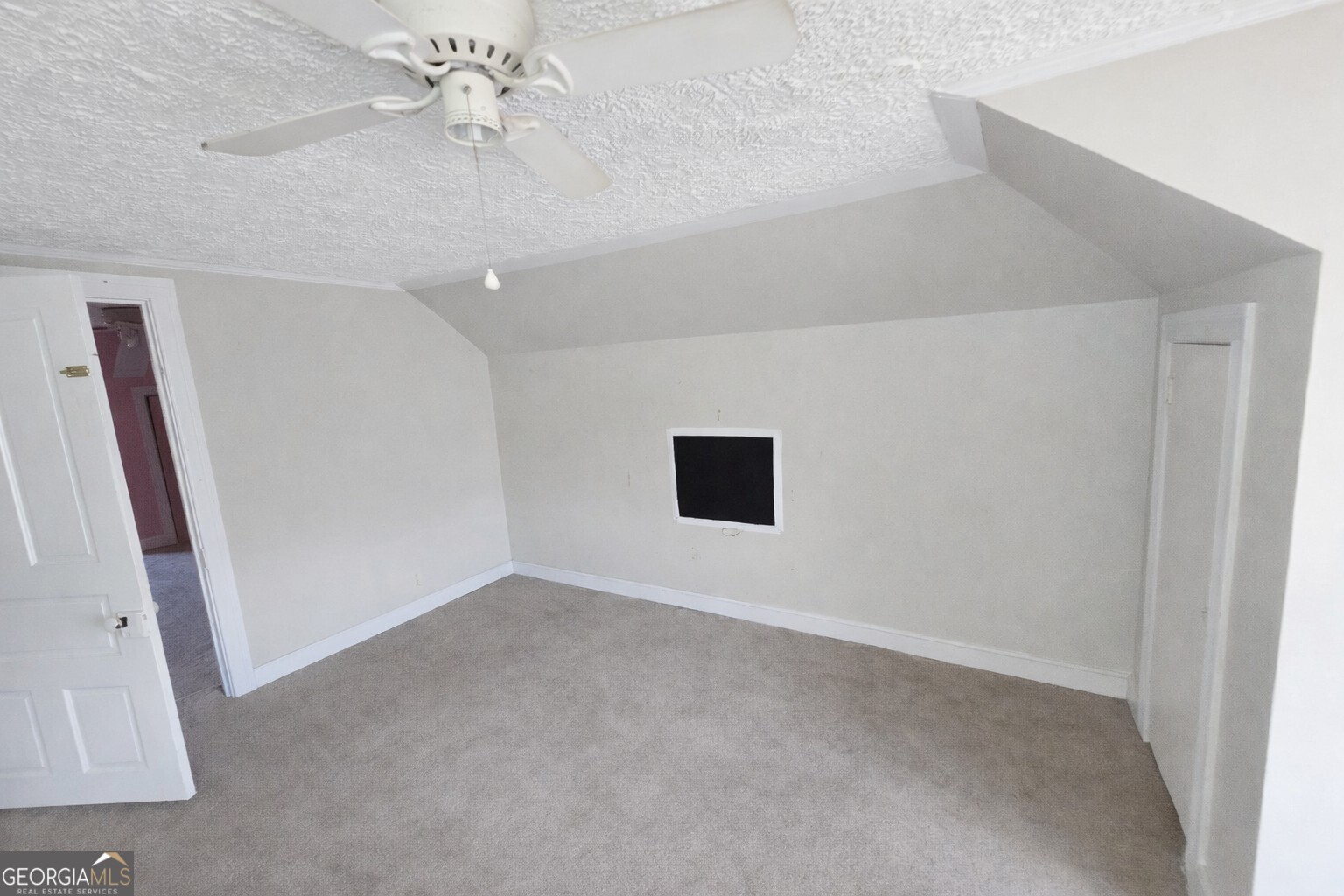 414 Wedowee Street Bowdon, GA 30108 - Photo 15 of 23 a view of an empty room with a window