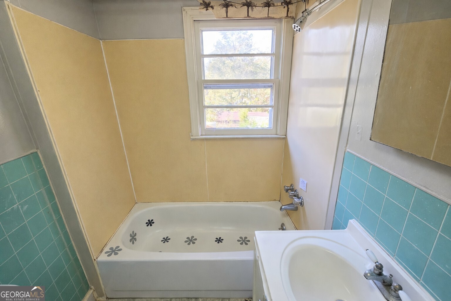 414 Wedowee Street Bowdon, GA 30108 - Photo 16 of 23 a bathroom with a bathtub a sink and a toilet