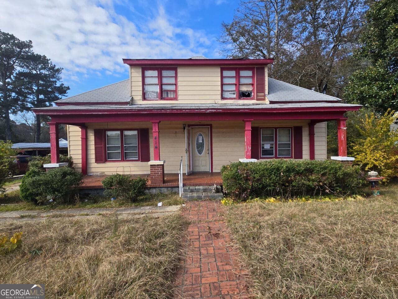414 Wedowee Street Bowdon, GA 30108 - Photo 23 of 23 a view of a house with a yard plants and large tree