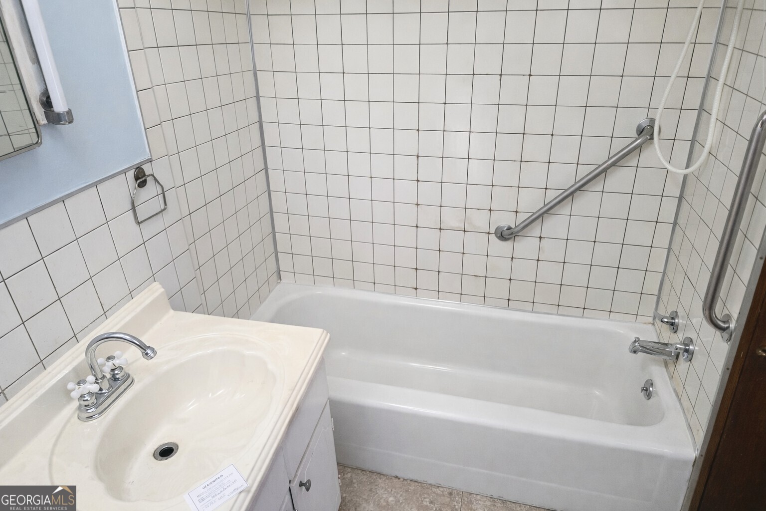 414 Wedowee Street Bowdon, GA 30108 - Photo 7 of 23 a bathroom with a white bathtub