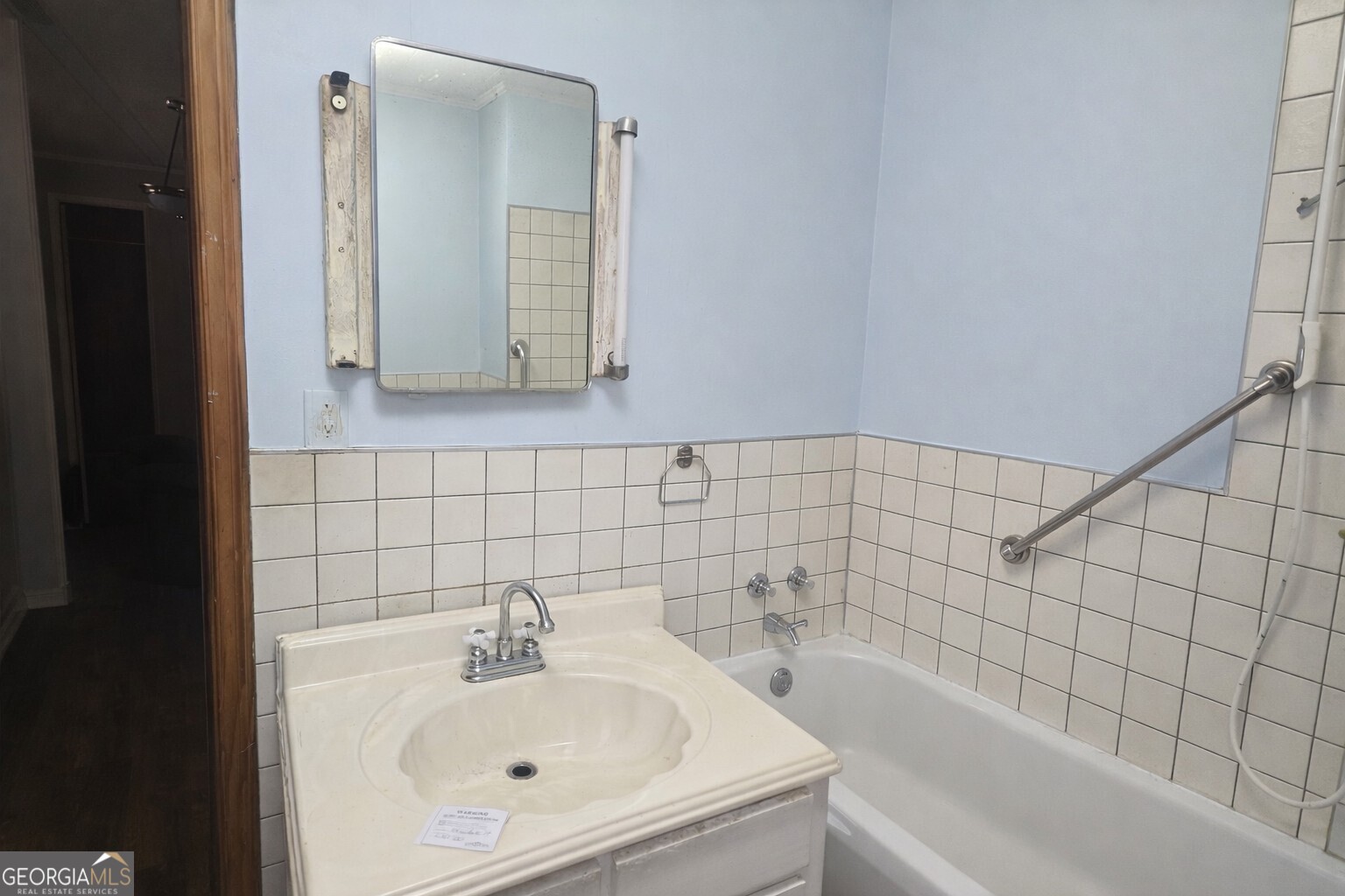 414 Wedowee Street Bowdon, GA 30108 - Photo 8 of 23 a bathroom with a bathtub and sink