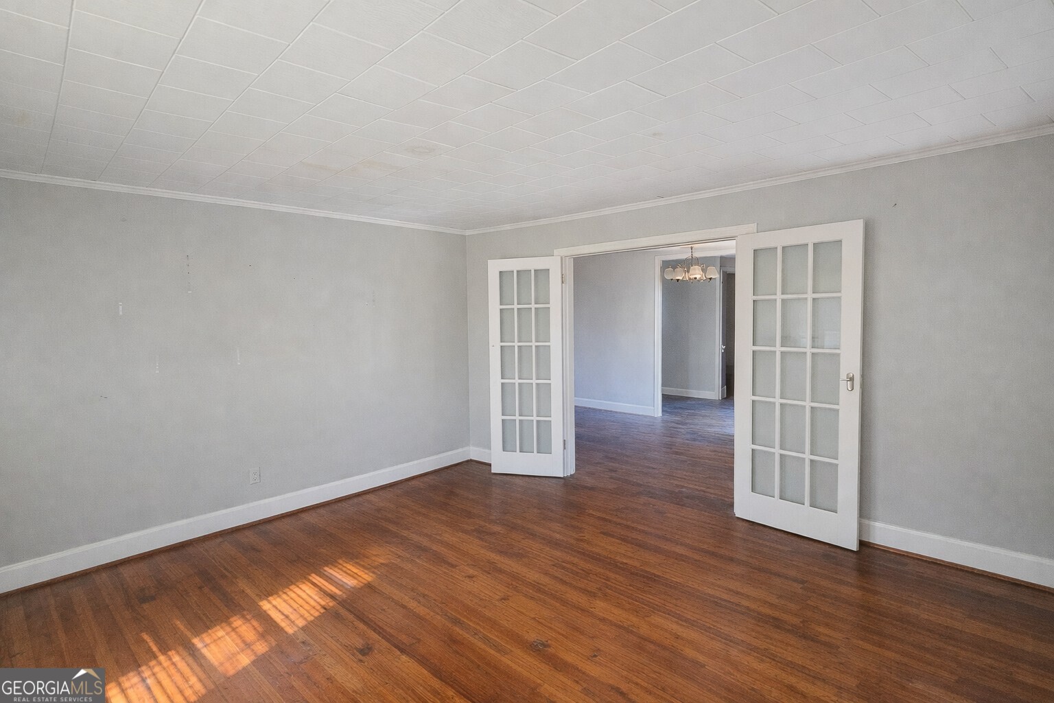 414 Wedowee Street Bowdon, GA 30108 - Photo 9 of 23 a view of an empty room with wooden floor and a window