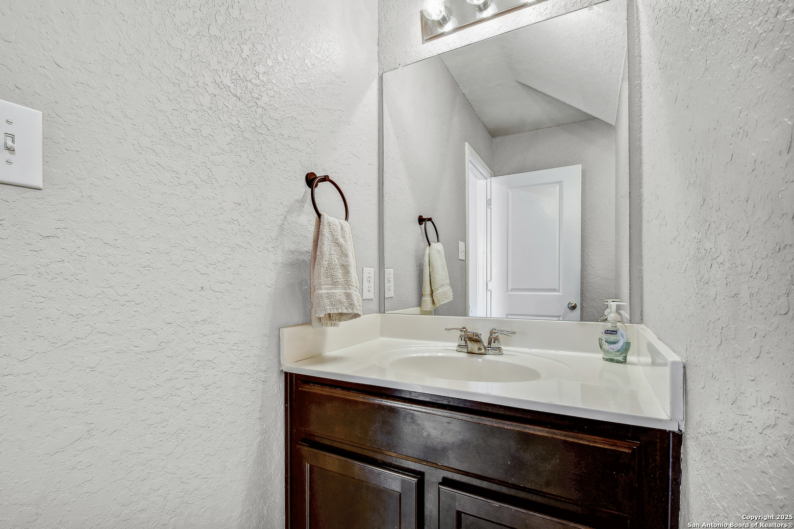 9627 Baytown Coast San Antonio, TX 78254 - Photo 13 of 22 a bathroom with a sink and a mirror