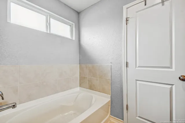 a bathroom with a bathtub