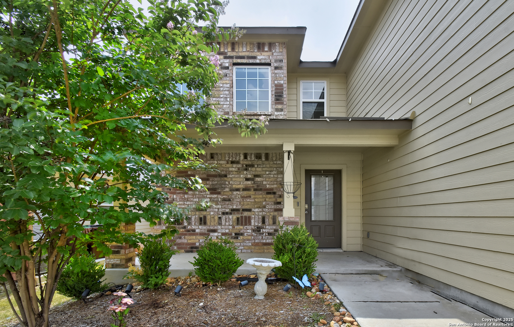 9627 Baytown Coast San Antonio, TX 78254 - Photo 2 of 22 a front view of a house with plants