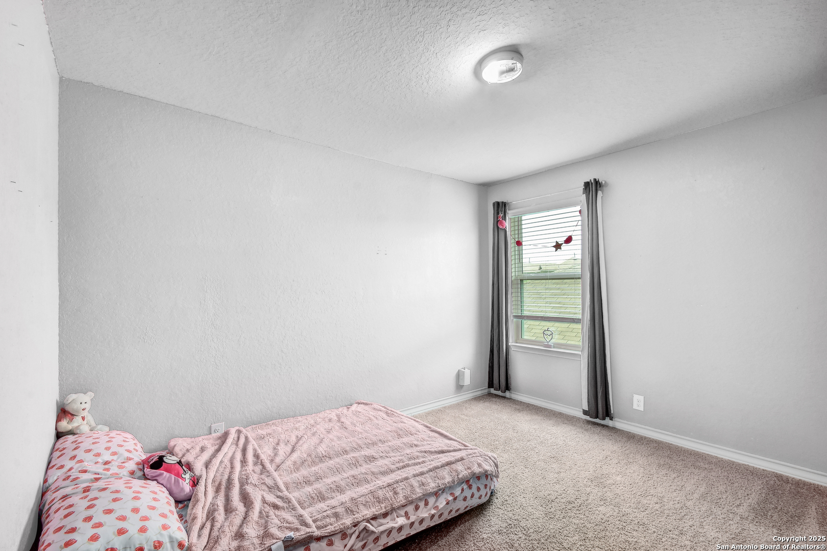 9627 Baytown Coast San Antonio, TX 78254 - Photo 21 of 22 a bedroom with a bed and a window