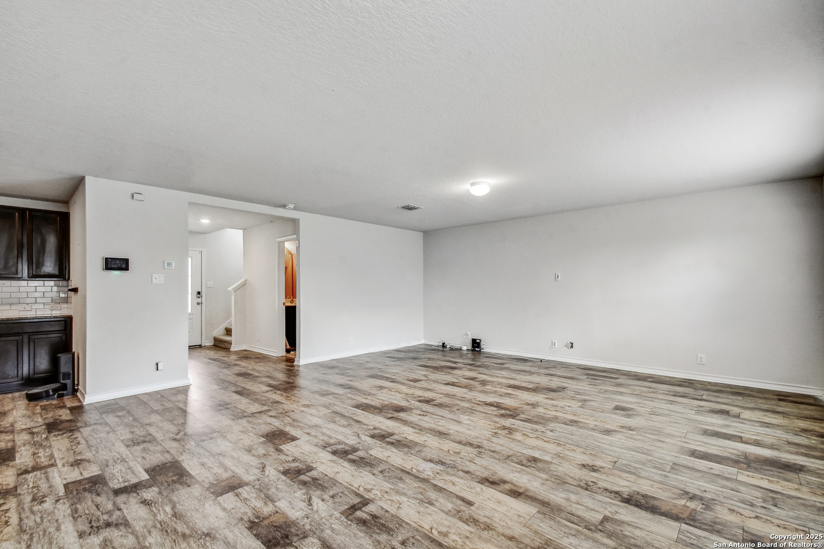 9627 Baytown Coast San Antonio, TX 78254 - Photo 6 of 22 a view of empty room with kitchen