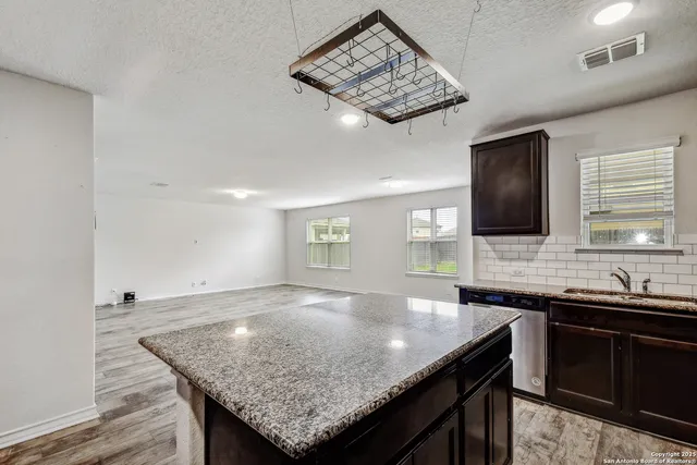a kitchen with a counter space and a sink