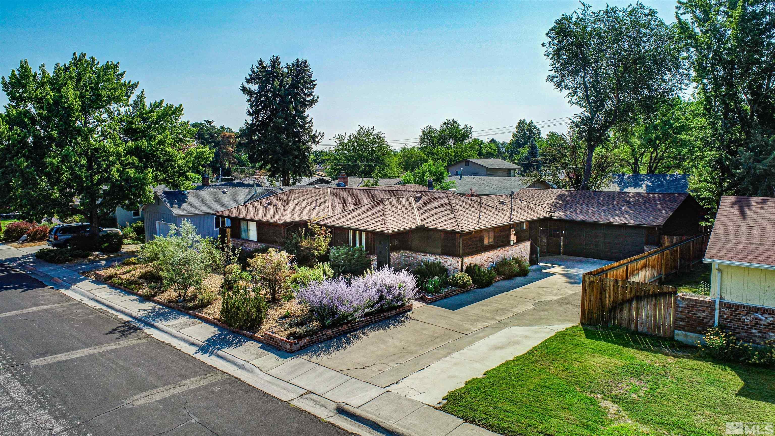 2160 Riviera Street Reno, NV 89509 - Photo 1 of 40 a front view of a house with garden
