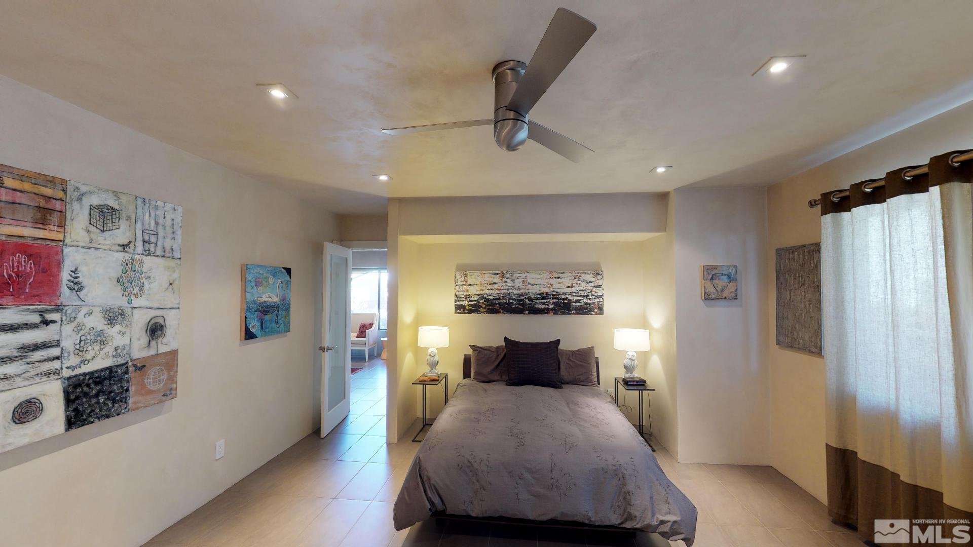 2160 Riviera Street Reno, NV 89509 - Photo 19 of 40 a bedroom with a bed and a refrigerator