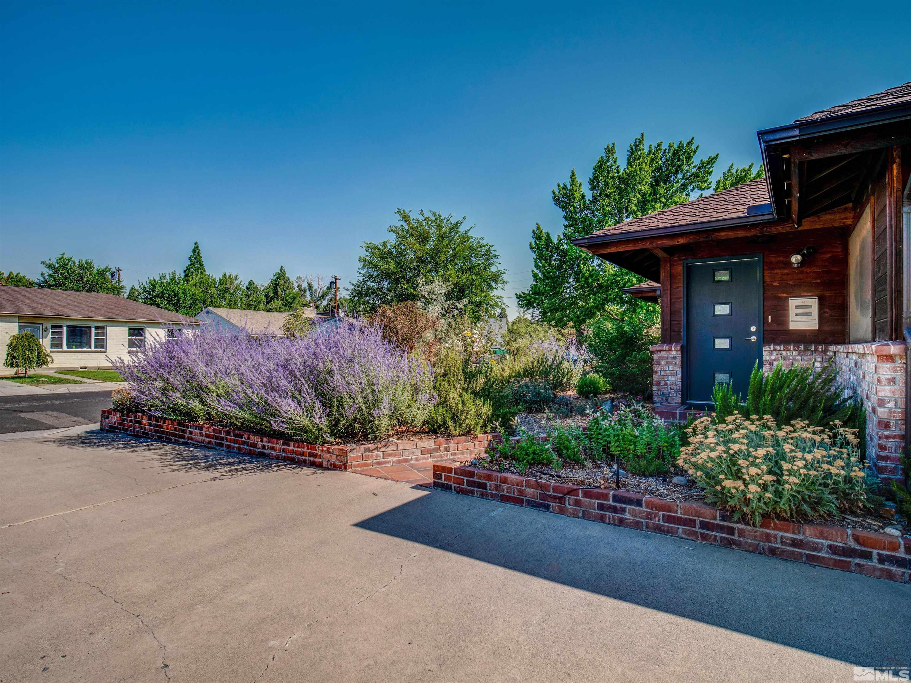 2160 Riviera Street Reno, NV 89509 - Photo 2 of 40 a pathway to a house with a street