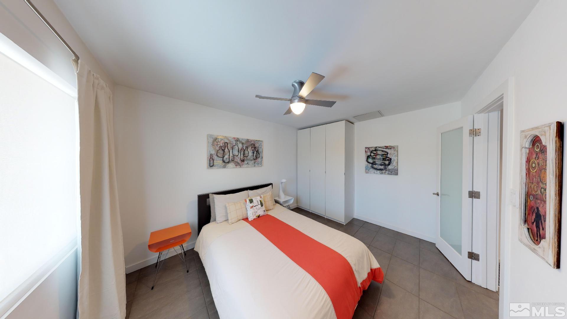 2160 Riviera Street Reno, NV 89509 - Photo 23 of 40 a bedroom with bed and paintings on the wall