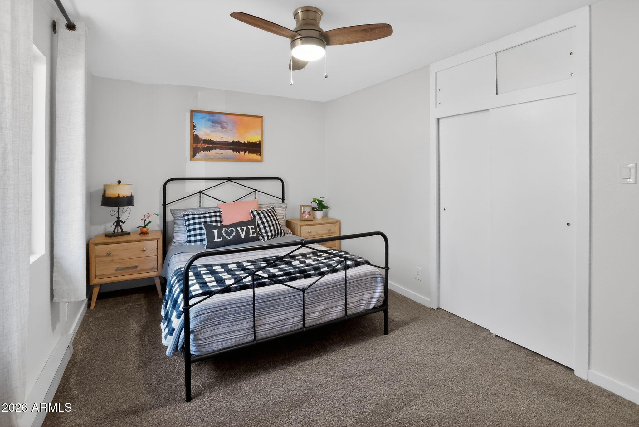 17160 Deer Run Road Munds Park, AZ 86017 - Photo 17 of 31 a bedroom with a bed and window
