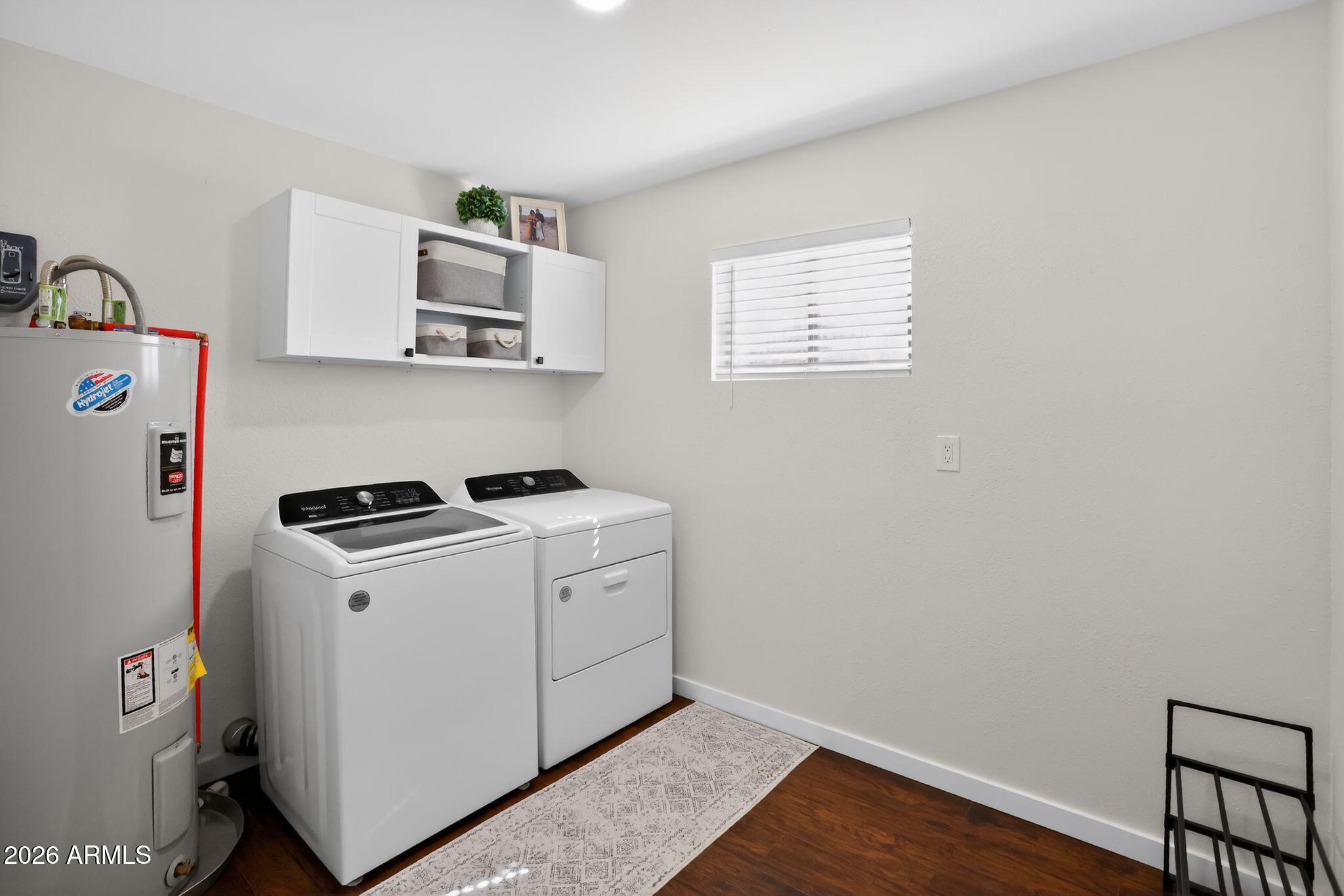 17160 Deer Run Road Munds Park, AZ 86017 - Photo 27 of 31 a view of washer and dryer with wooden floor
