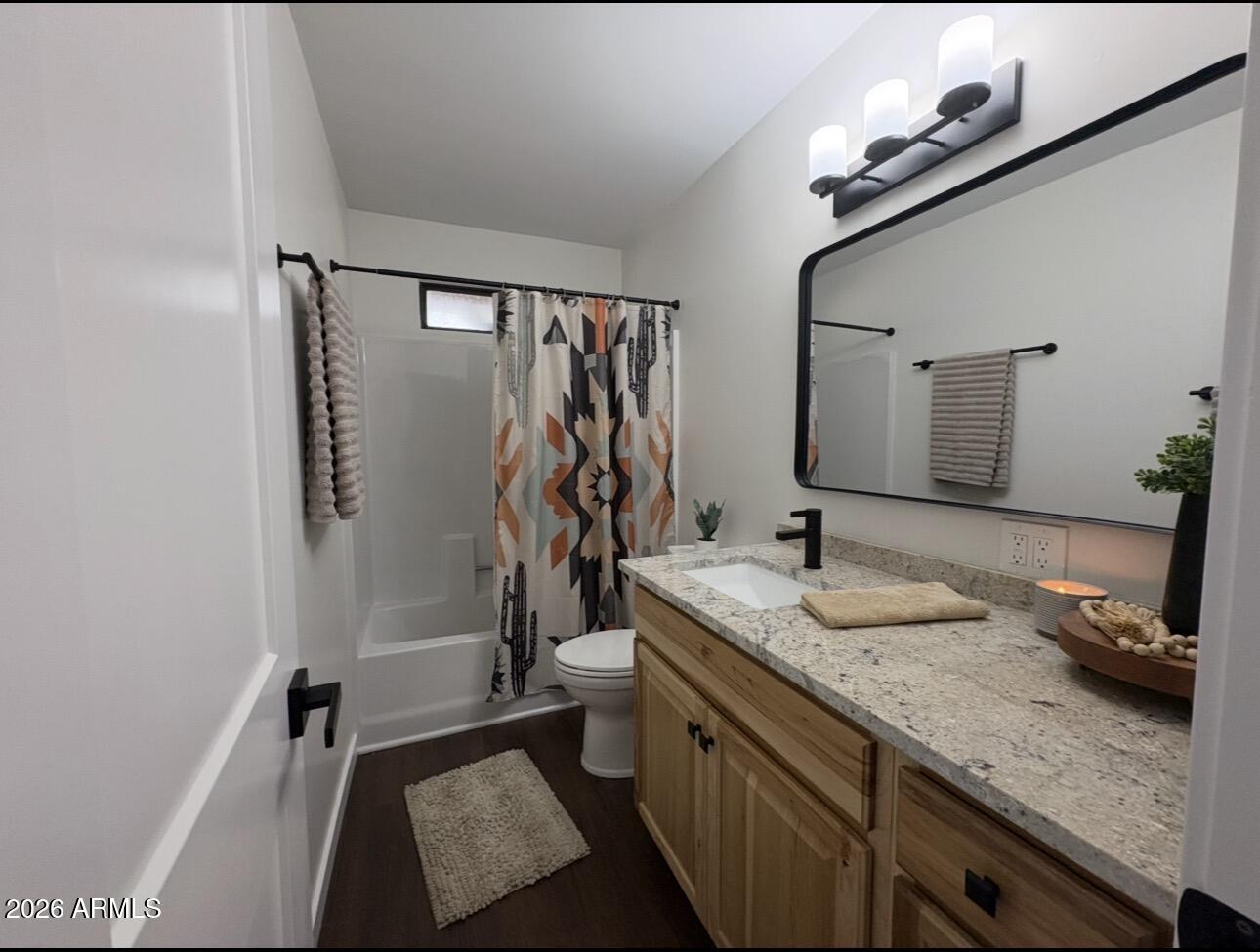 17160 Deer Run Road Munds Park, AZ 86017 - Photo 30 of 31 a bathroom with a granite countertop sink a mirror and shower