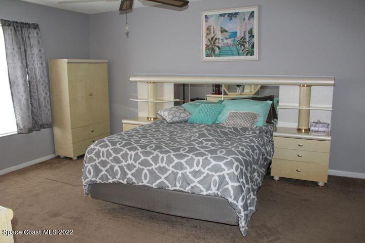 1324 Zanzibar Road Southeast Palm Bay, FL 32909 - Photo 12 of 18 a bed sitting in a bedroom next to a window