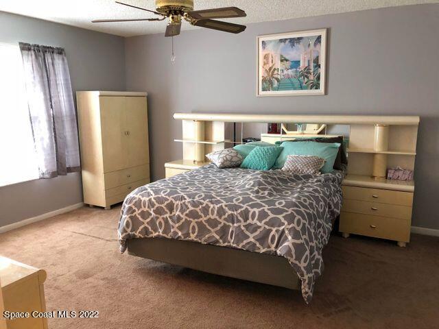 1324 Zanzibar Road Southeast Palm Bay, FL 32909 - Photo 13 of 18 a bedroom with a bed and dresser