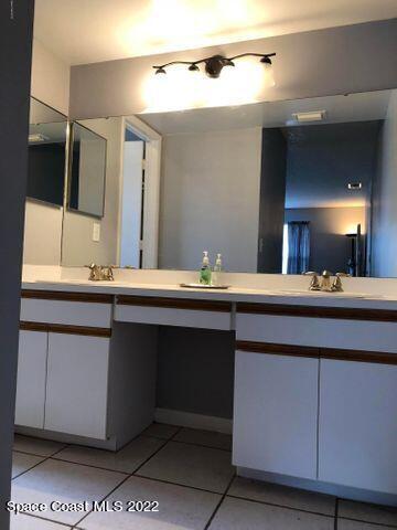 1324 Zanzibar Road Southeast Palm Bay, FL 32909 - Photo 15 of 18 a bathroom with a sink and a mirror