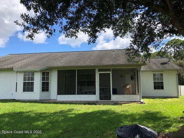 1324 Zanzibar Road Southeast Palm Bay, FL 32909 - Photo 3 of 18 front view of a house with a yard
