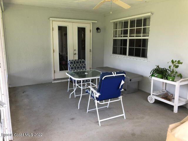 1324 Zanzibar Road Southeast Palm Bay, FL 32909 - Photo 5 of 18 a dining room with furniture and potted plants