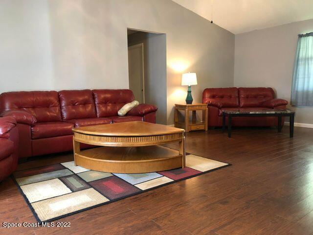 1324 Zanzibar Road Southeast Palm Bay, FL 32909 - Photo 6 of 18 a living room with furniture a rug and a window