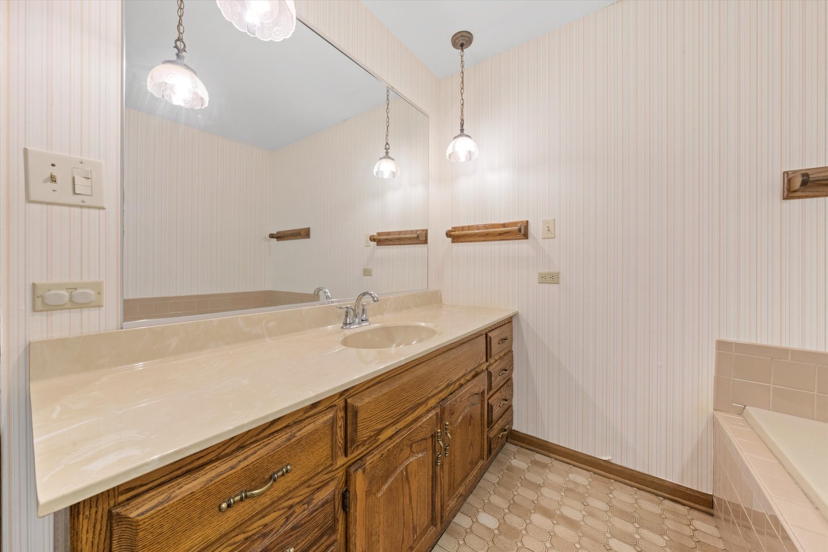 24449 South Klemme Road Crete, IL 60417 - Photo 12 of 21 a bathroom with a sink a vanity and mirror
