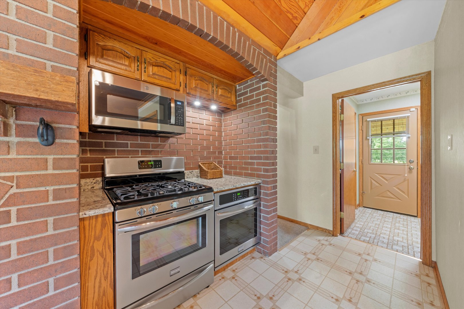 24449 South Klemme Road Crete, IL 60417 - Photo 15 of 21 a kitchen with stainless steel appliances granite countertop a stove and a microwave