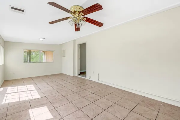 a view of an empty room and window