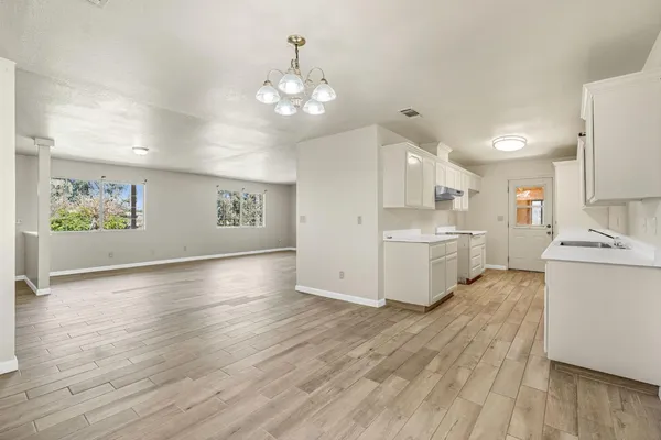a view of a kitchen with electric appliances