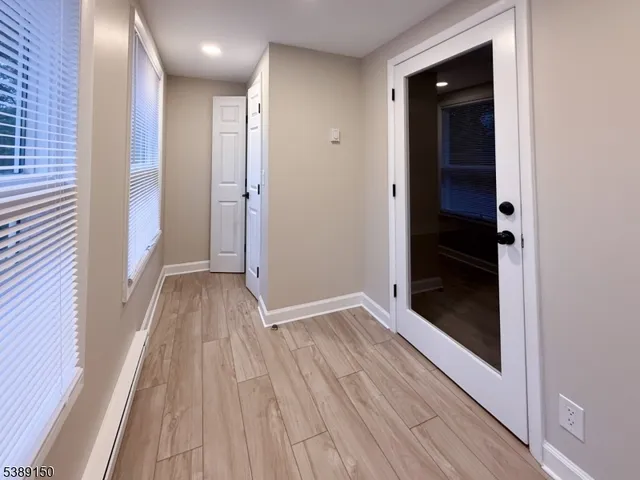 wooden floor in an empty room with a gallery