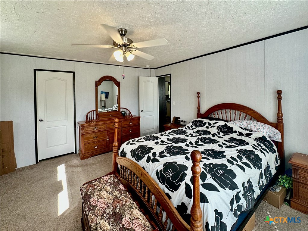 815 Track Road Dale, TX 78616 - Photo 11 of 21 a bedroom with a bed and dresser