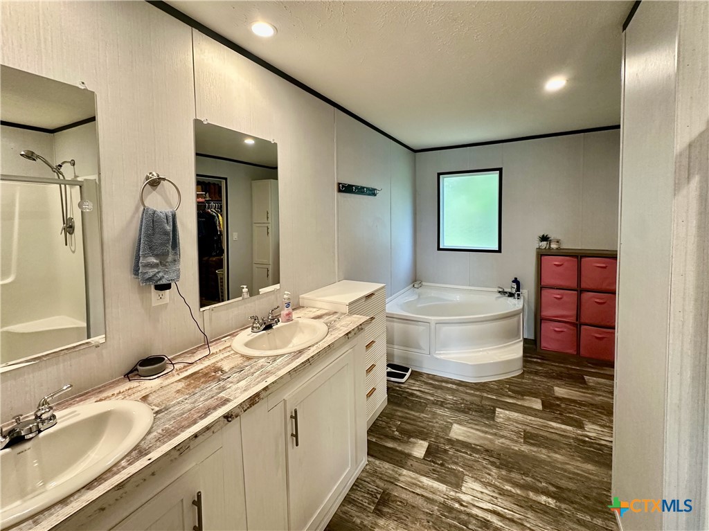 815 Track Road Dale, TX 78616 - Photo 12 of 21 a bathroom with a granite countertop sink toilet and mirror