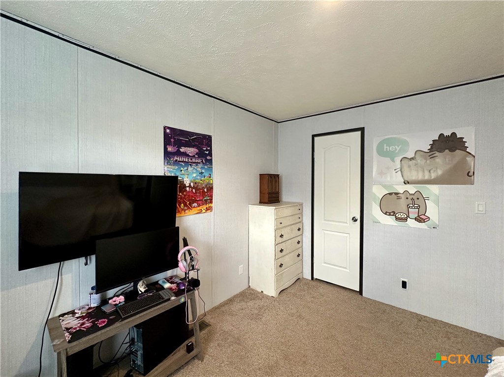 815 Track Road Dale, TX 78616 - Photo 20 of 21 a room with furniture and flat screen tv